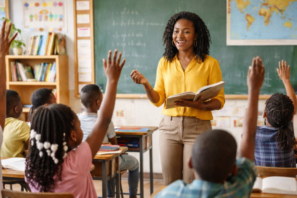 Teacher guiding students in active learning classroom