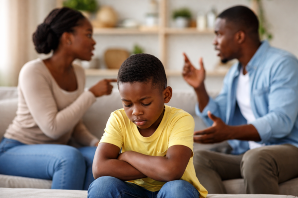 Parent listening empathetically to a child, illustrating healthy parenting habits that support emotional well-being and secure emotional development.