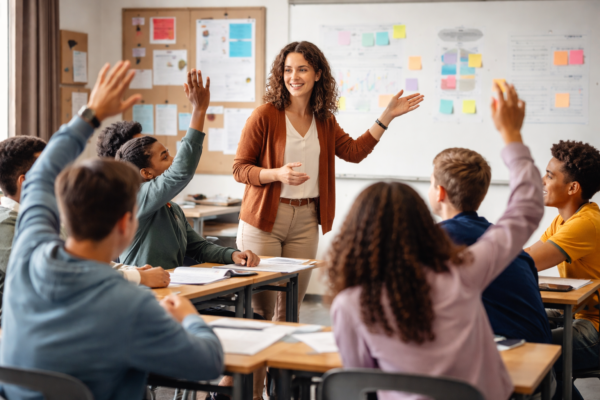 A teacher engaging students in an interactive classroom discussion, illustrating modern teaching methods, active learning, and student-centered education.