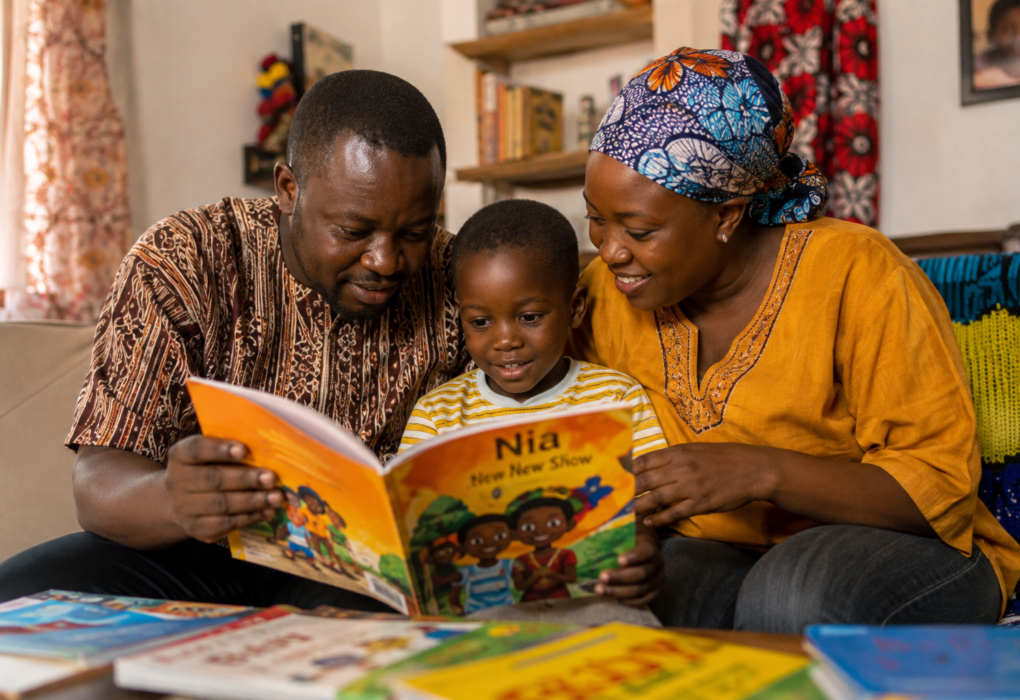 African parent reading a children's book with a young child at home
